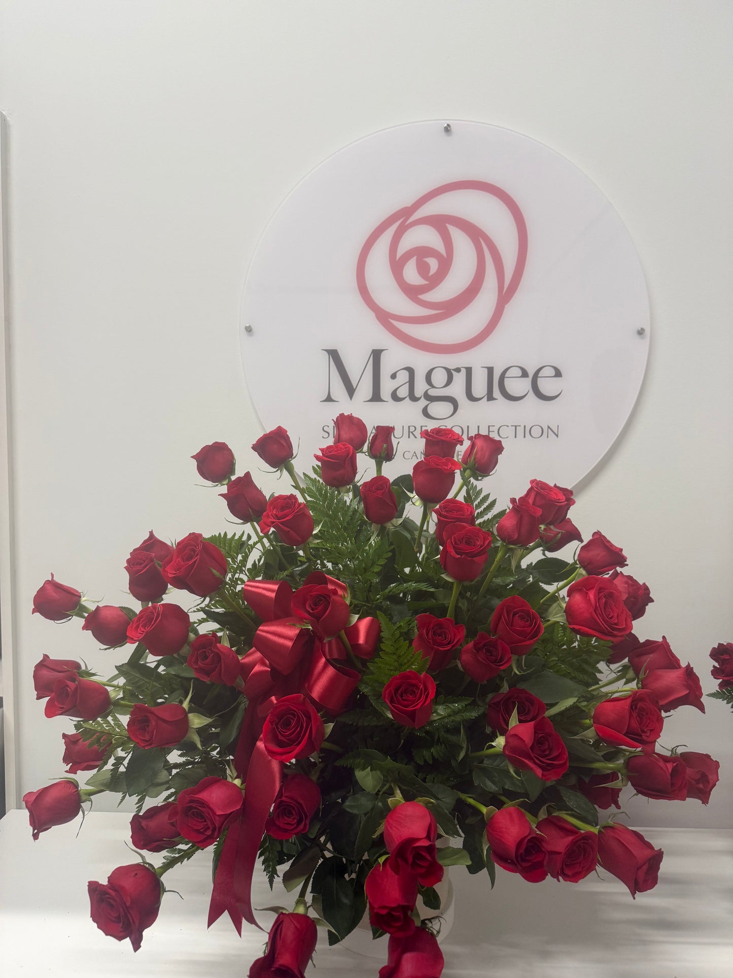 Regal Embrace – 60 Long Stem Roses in white ceramic Vase