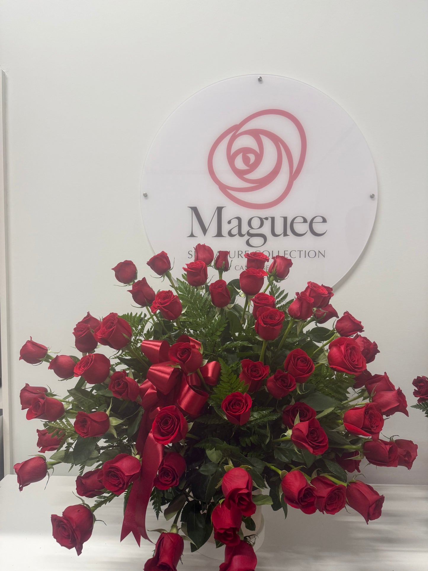 Regal Embrace – 60 Long Stem Roses in white ceramic Vase